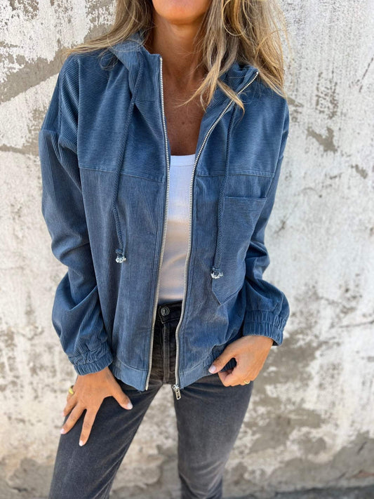 Veste unie en velours zippée à capuche .