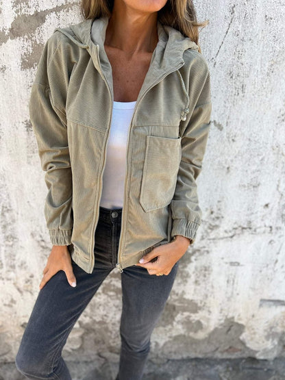 Veste unie en velours zippée à capuche .