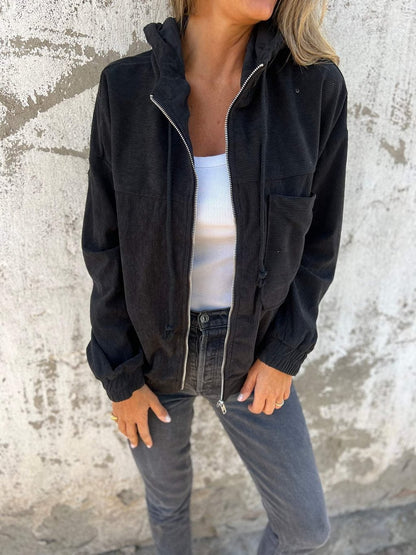 Veste unie en velours zippée à capuche .